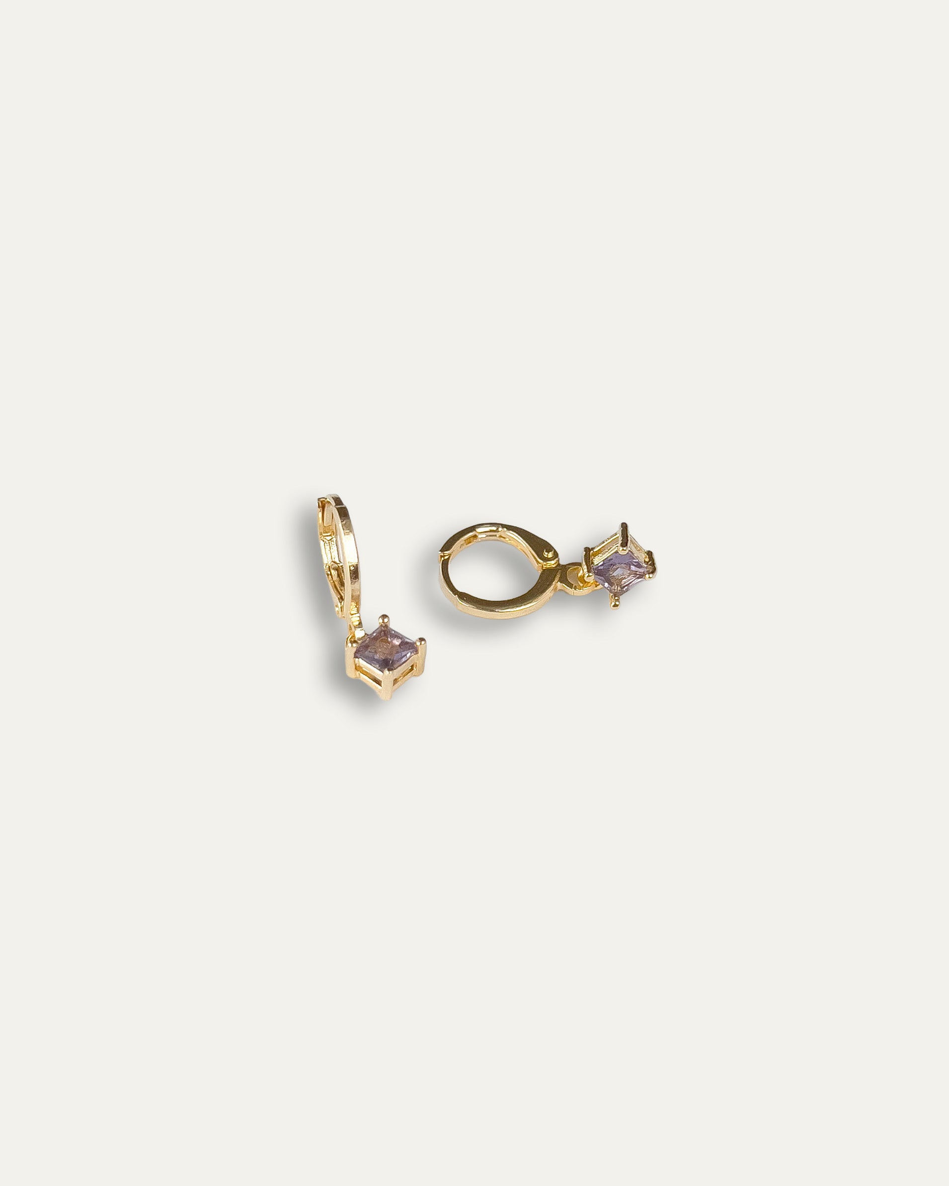 Clara earrings with gold hoop earring set and small dangle earrings, a timeless and chic accessory.
