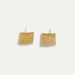 Leona earrings with gold hoop earring set and small dangle earrings, a timeless and chic accessory.