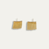 Leona earrings with gold hoop earring set and small dangle earrings, a timeless and chic accessory.