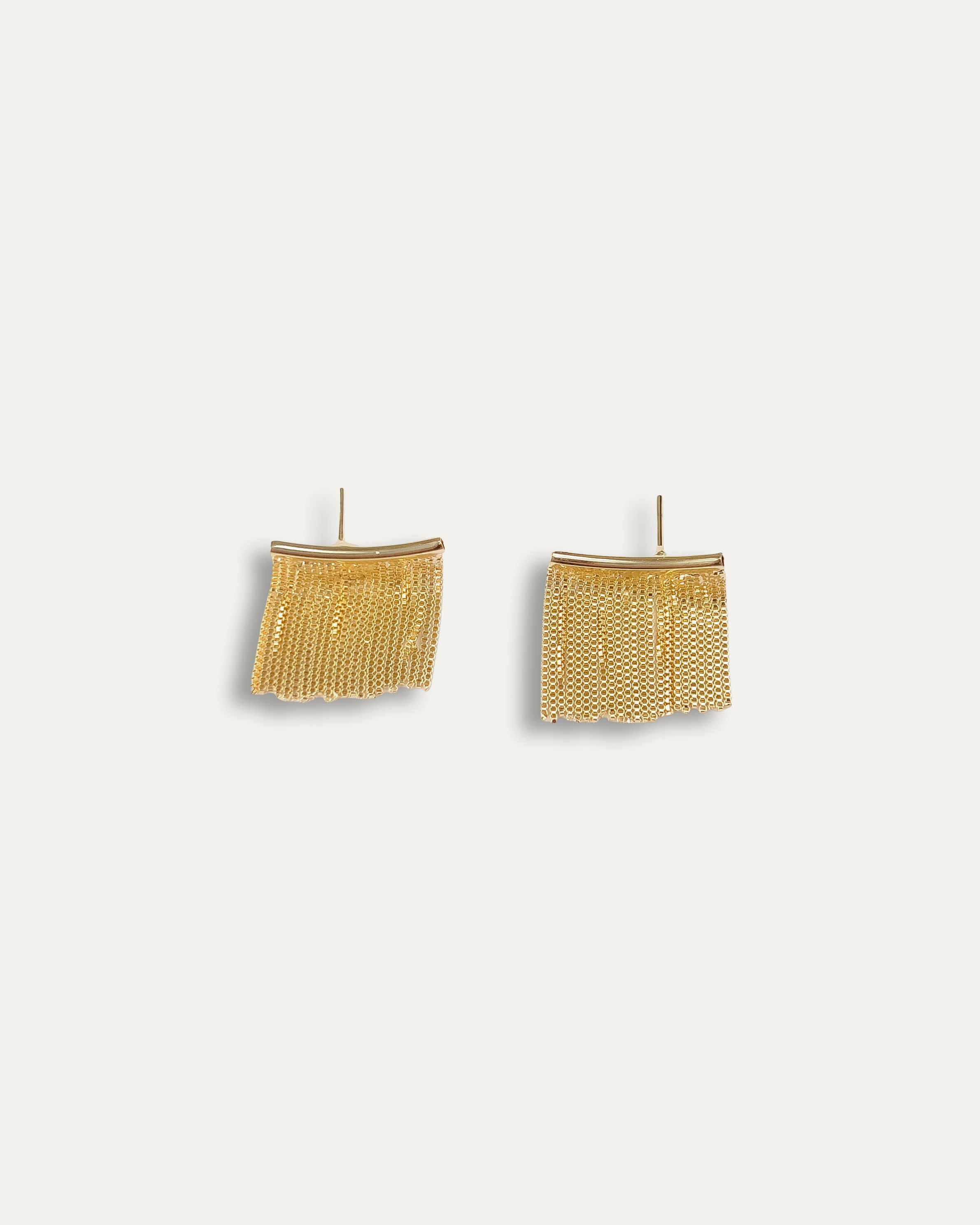 Leona earrings with gold hoop earring set and small dangle earrings, a timeless and chic accessory.