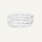 Clear resin bracelet with raised bubbles and a rounded form.
