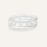 Clear resin bracelet with raised bubbles and a rounded form.
