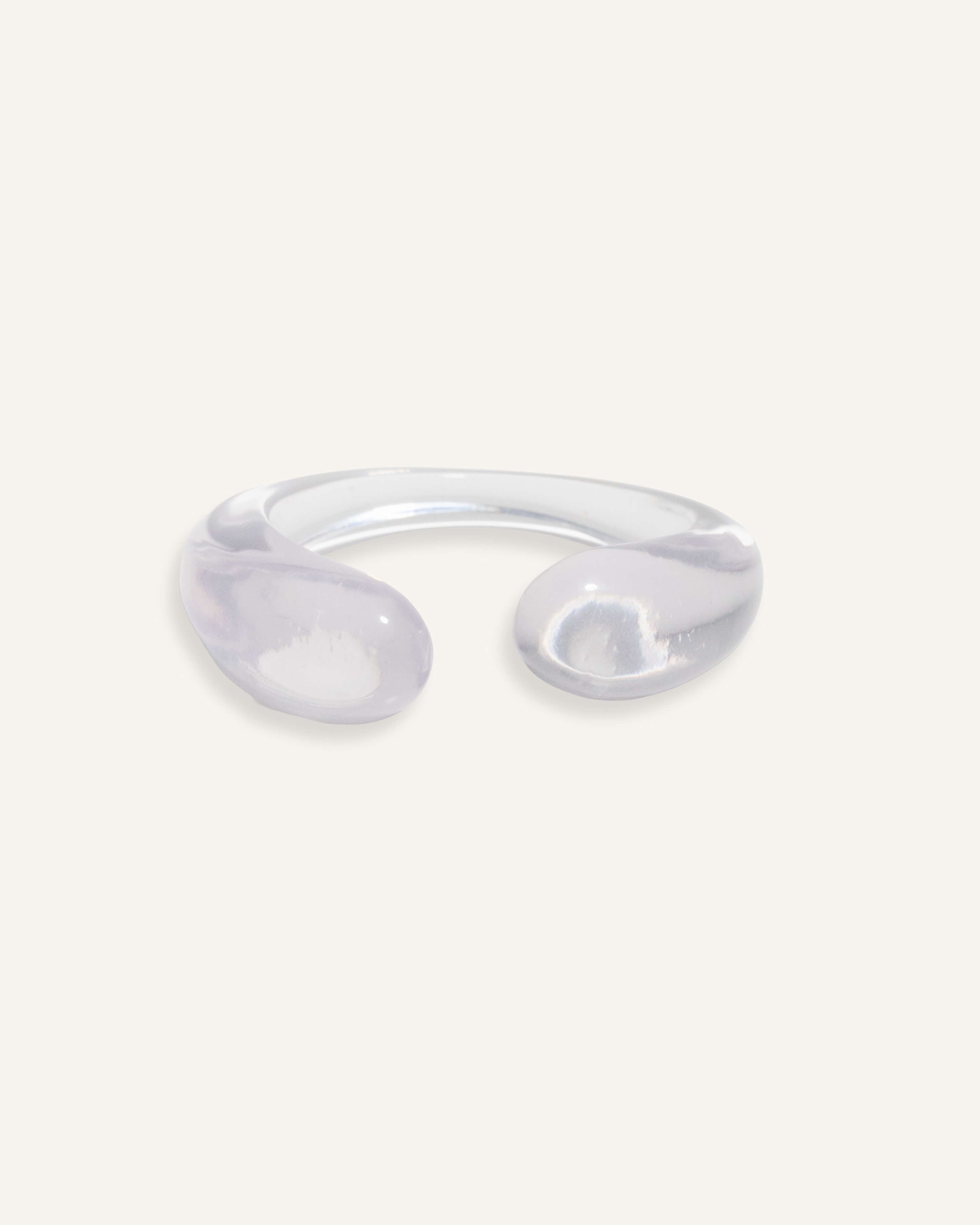 Clear open cuff bracelet with rounded ends, minimal resin design.
