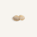 Gold plated shell stud earrings with rows of clear crystals.
