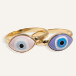 Gold evil eye bracelet with 3D enamel charm on fixed-size chain, styled for women.