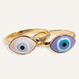 Gold evil eye bracelet with 3D enamel charm on fixed-size chain, styled for women.