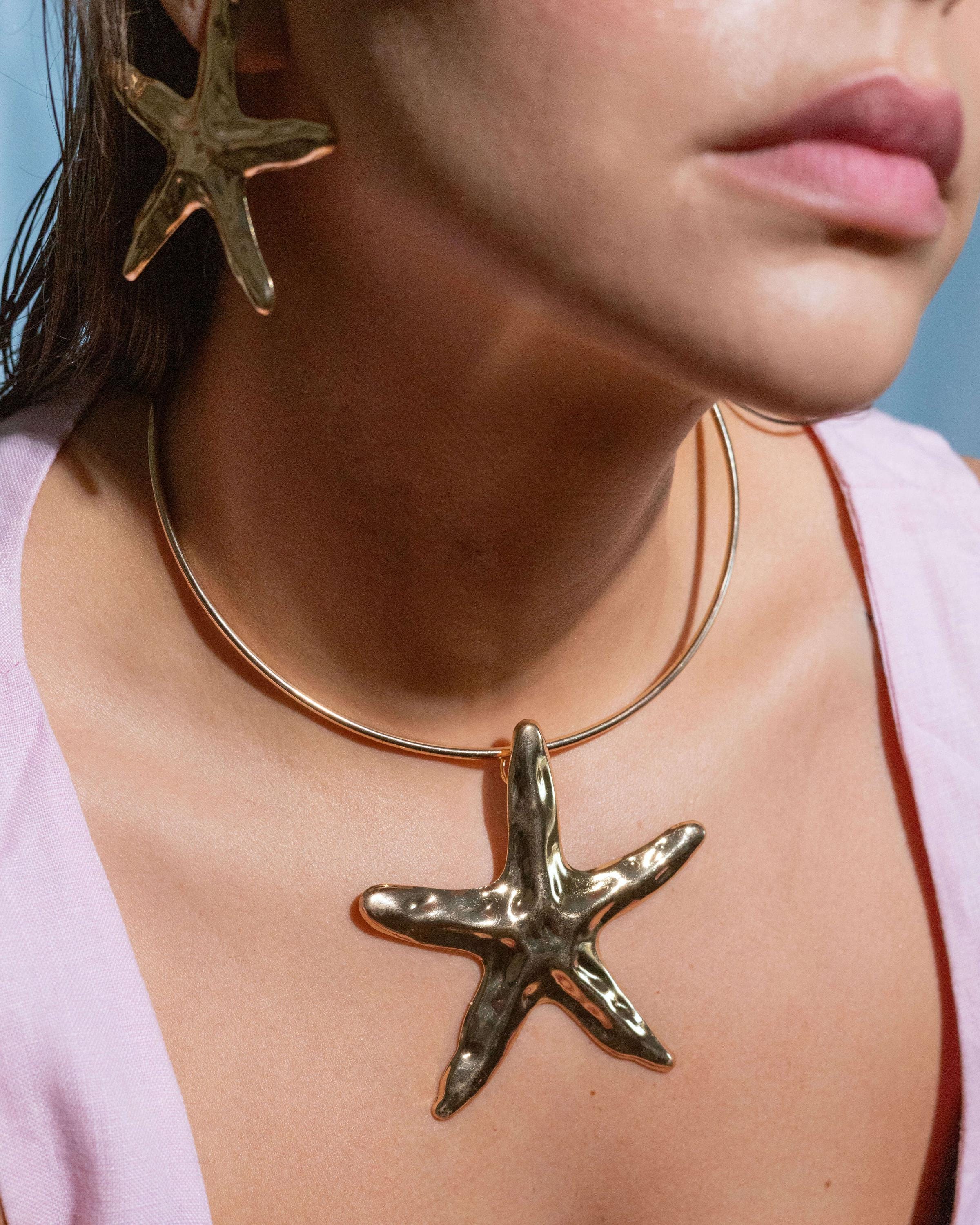 Gold plated starfish pendant necklace with hammered texture, bold beachy statement choker for summer, ocean-inspired jewelry for women