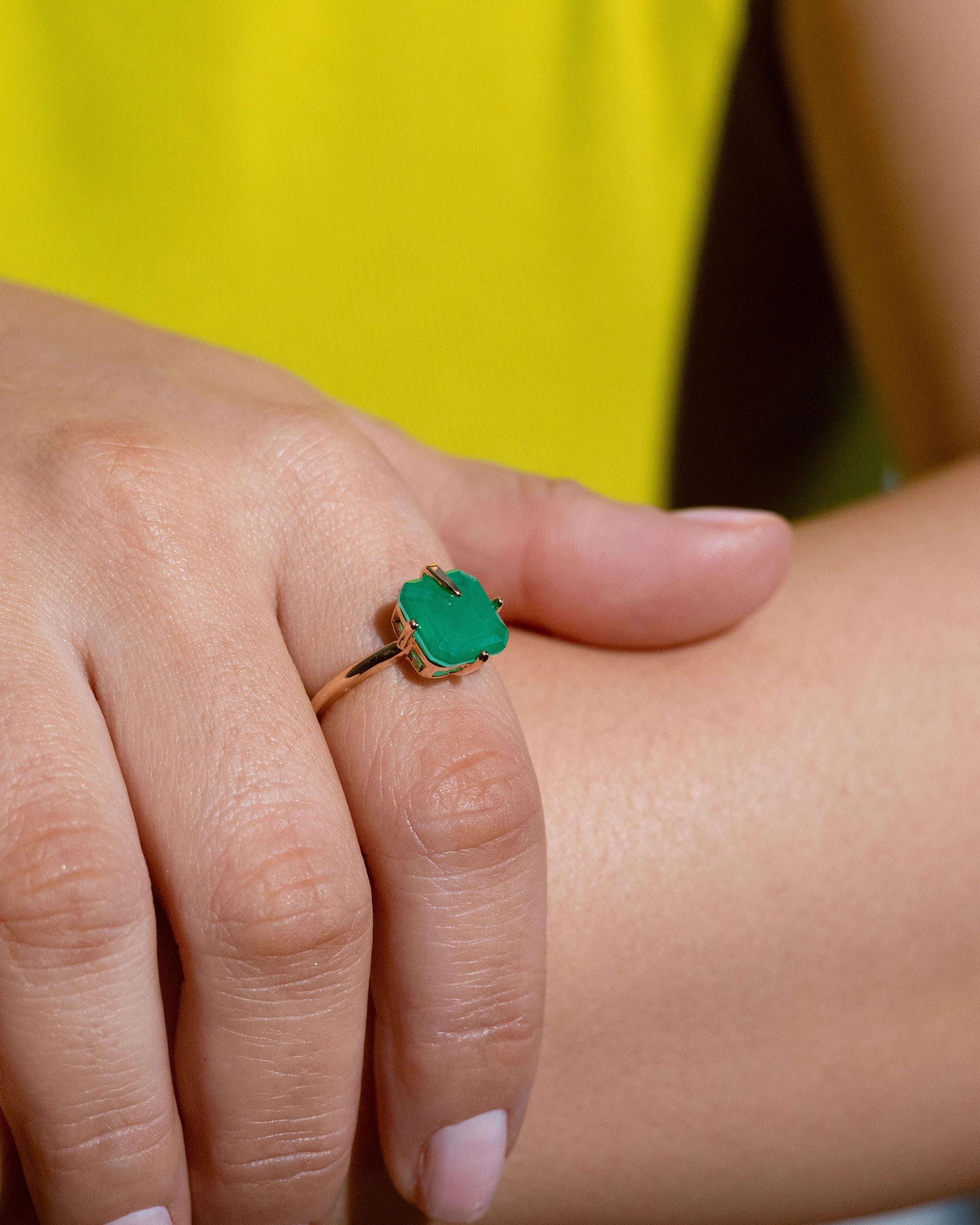 Adjustable gold plated ring with faceted green gemstone in a prong setting, bold statement cocktail ring for women, open band fashion jewelry gift