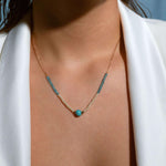 Model wearing turquoise and pearl beaded necklace with gold chain, layered summer jewelry look, perfect for casual outfits or vacation style