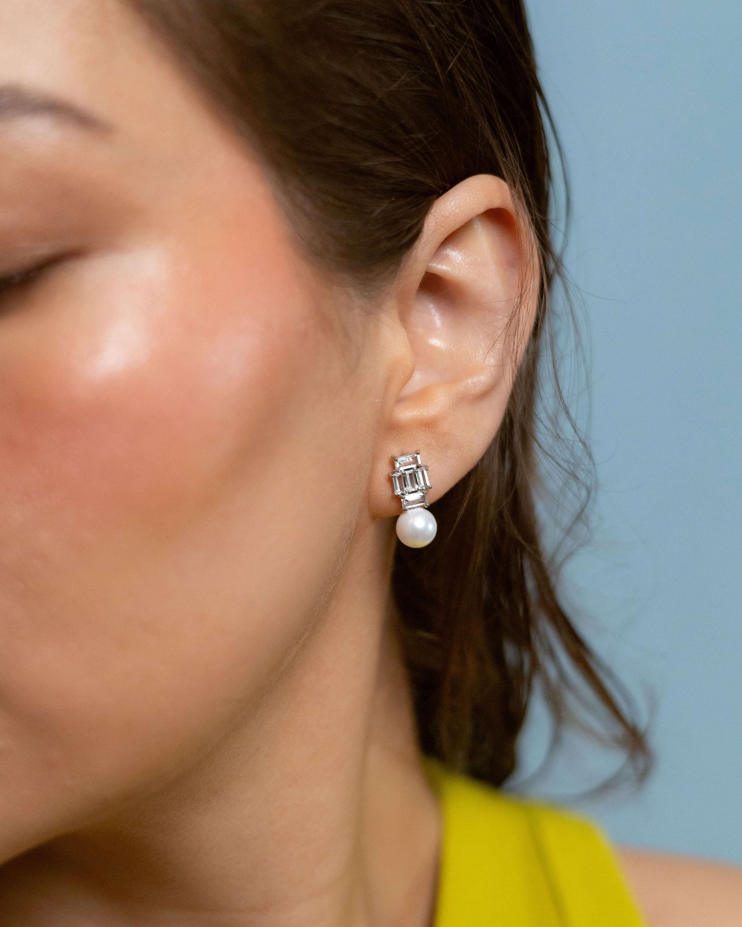 Rhodium plated drop earrings with cubic zirconia and pearl accents, elegant bridal or wedding jewelry for women