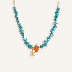 Turquoise chip necklaces with colorful ceramic fish beads and small gold star charms, in orange and blue variations.