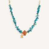 Turquoise chip necklaces with colorful ceramic fish beads and small gold star charms, in orange and blue variations.