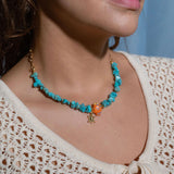 Turquoise gemstone chip necklace with orange ceramic fish charm and gold starfish pendant, 14k gold filled chain, playful ocean-inspired beach jewelry