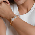 gold plated double pearl bracelet with two white pearls, modern minimalist bangle jewelry for women
