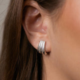 Claire earrings with gold hoop earring set and small dangle earrings, a timeless and chic accessory.