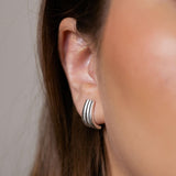 Claire earrings with gold hoop earring set and small dangle earrings, a timeless and chic accessory.