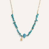 Turquoise chip necklaces with colorful ceramic fish beads and small gold star charms, in orange and blue variations.