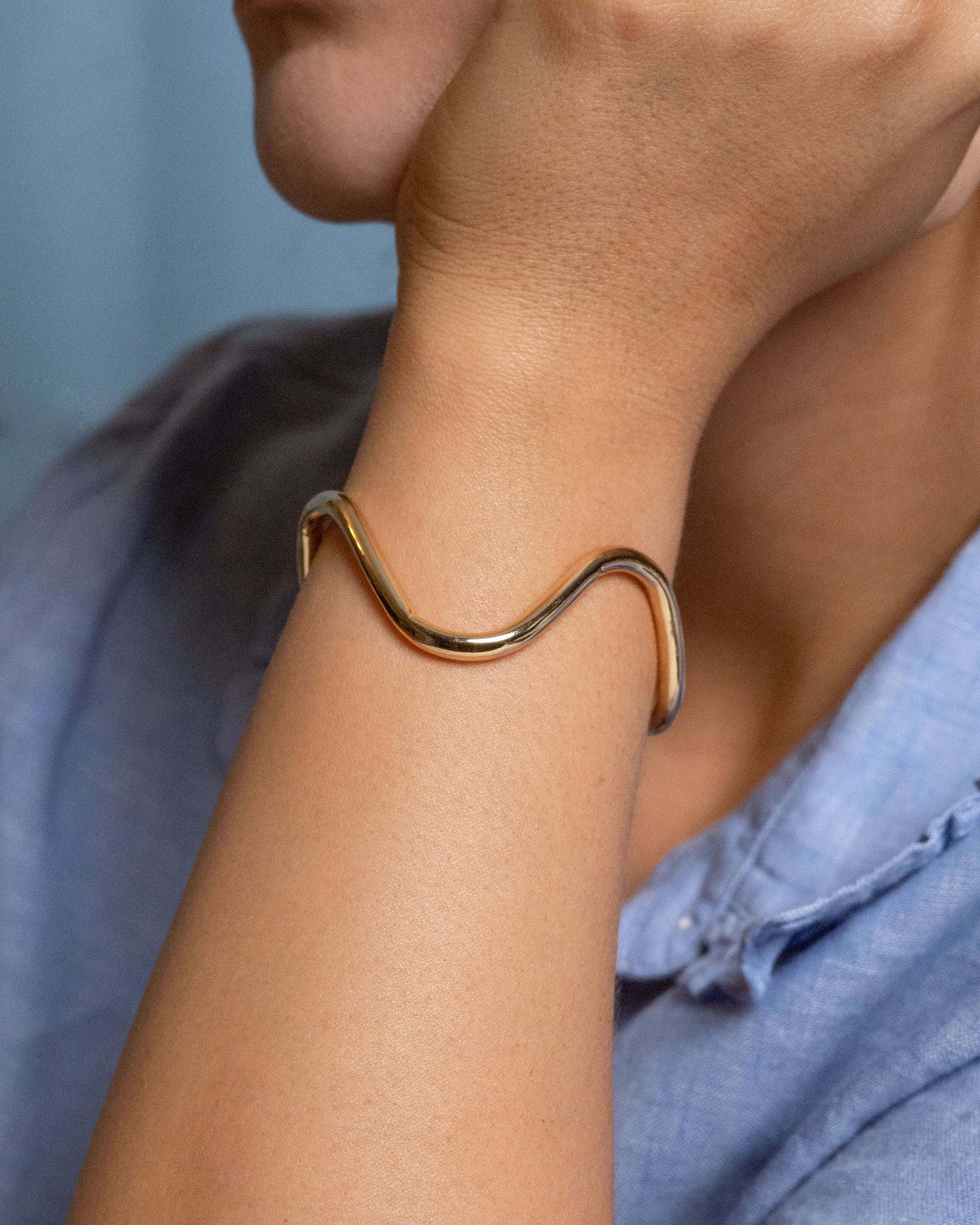 Gold plated wave cuff bracelet with sleek fluid design, open bangle style adjustable bracelet for women, modern minimalist gold accessory