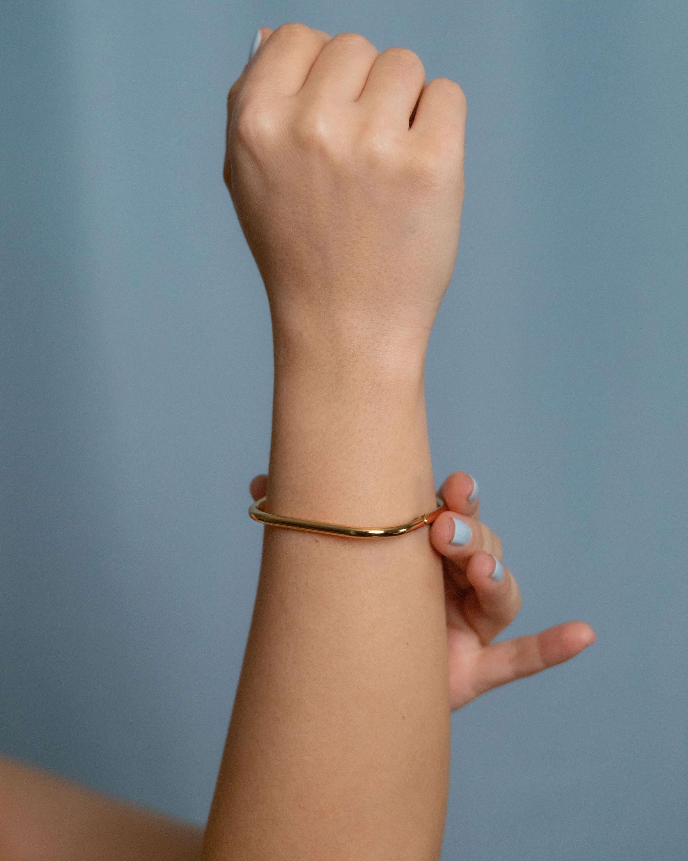 Gold square bangle bracelet with open hinge, minimalist geometric cuff for women’s modern and stackable jewelry looks