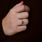 Dainty green zirconia ring with sparkling light green stones on elegant band, versatile Loon Concept jewelry