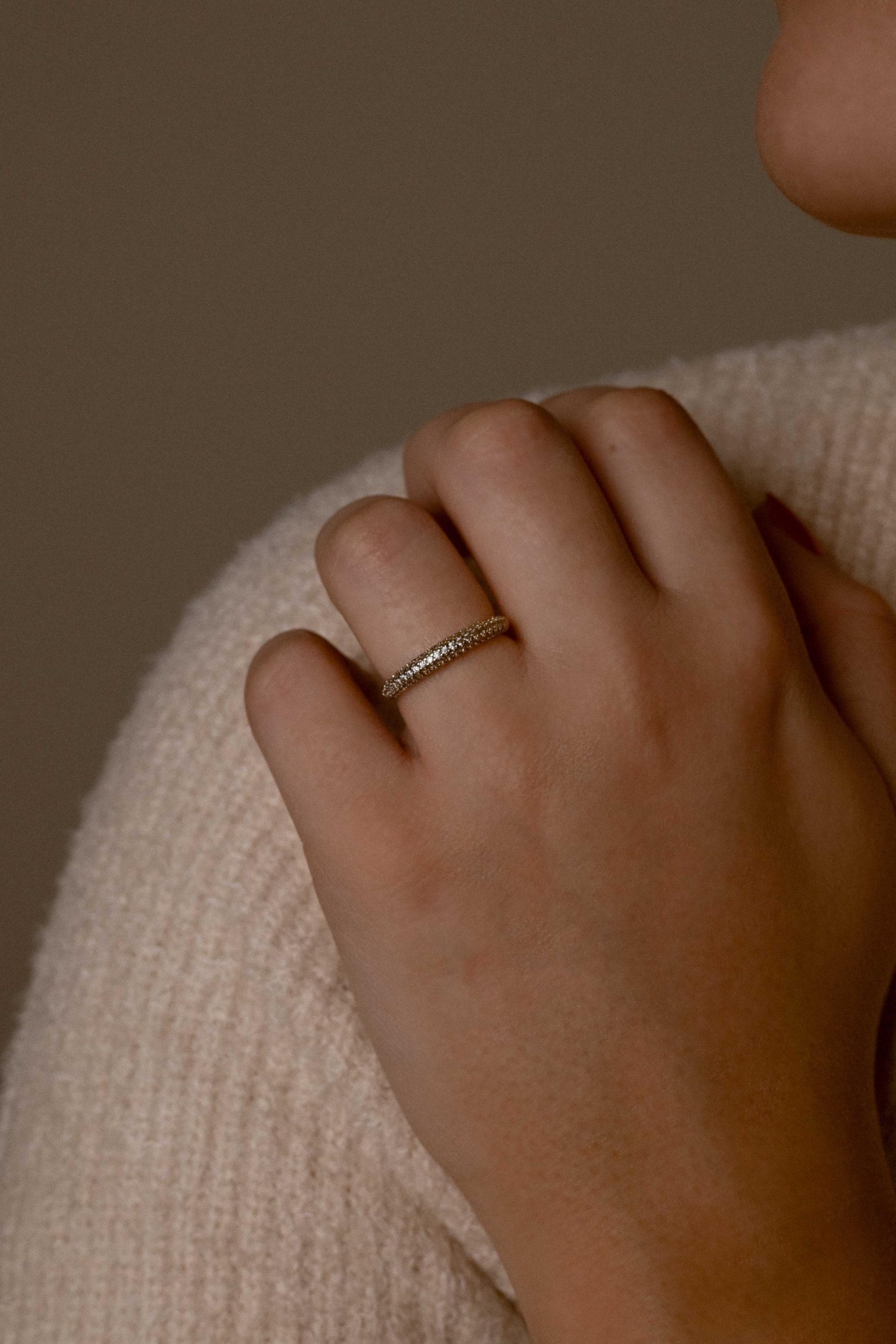 Close-up of silver rings with thick bands and zircon accents