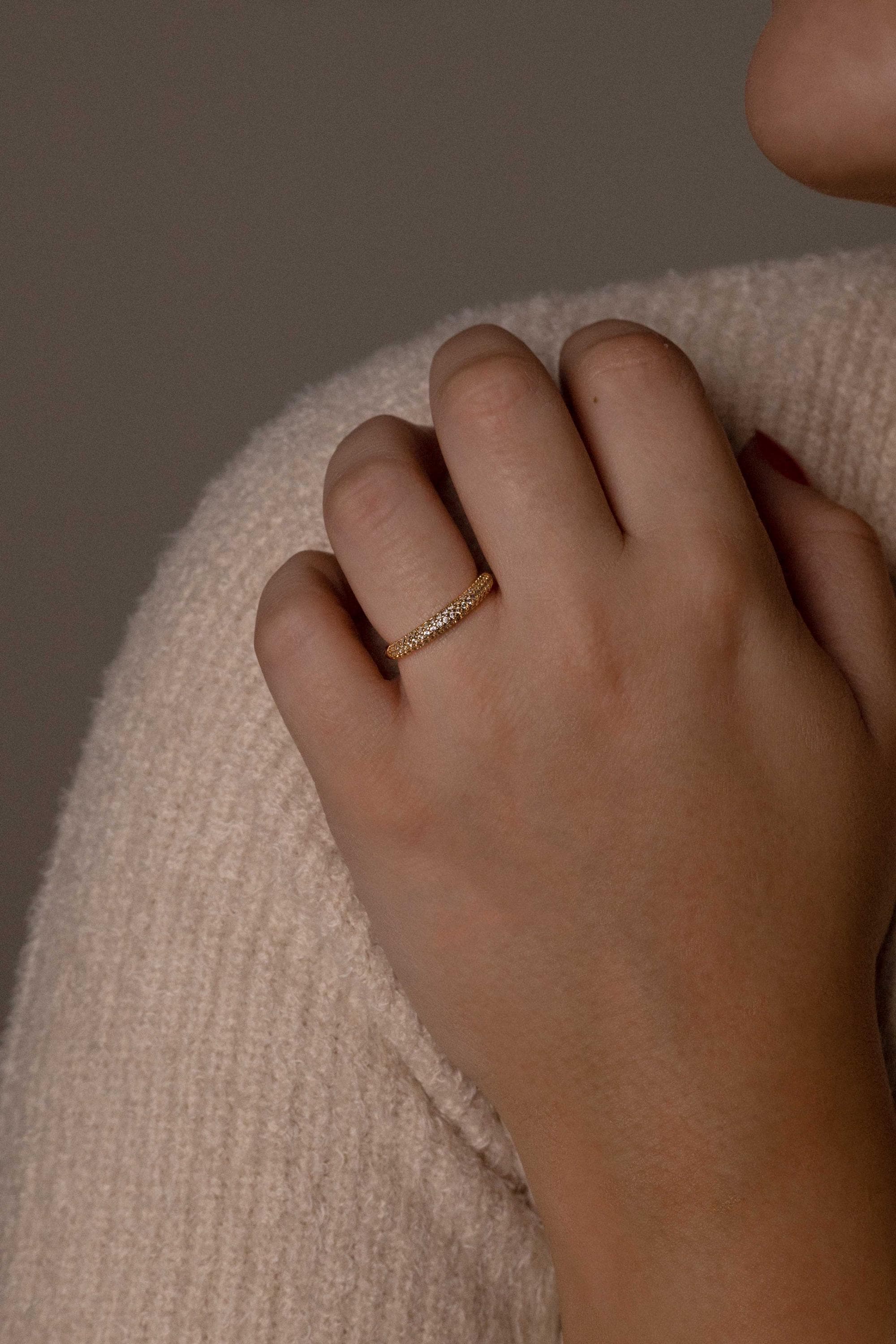 A set of chunky silver rings in rhodium, gold, and rose-plated designs