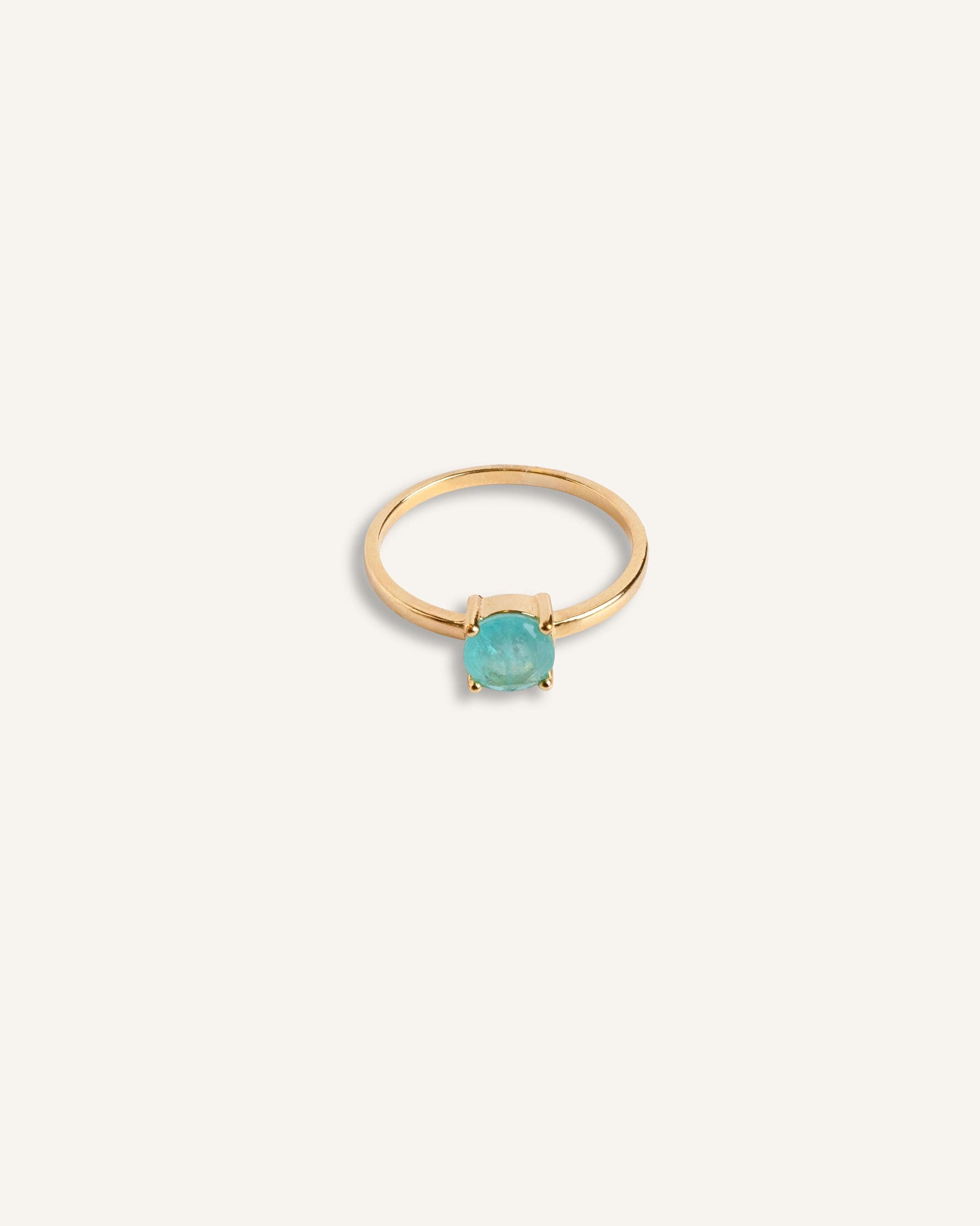 14K gold stone ring with a turquoise crystal centerpiece