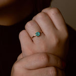 Close-up of handcrafted stone ring with turquoise detail