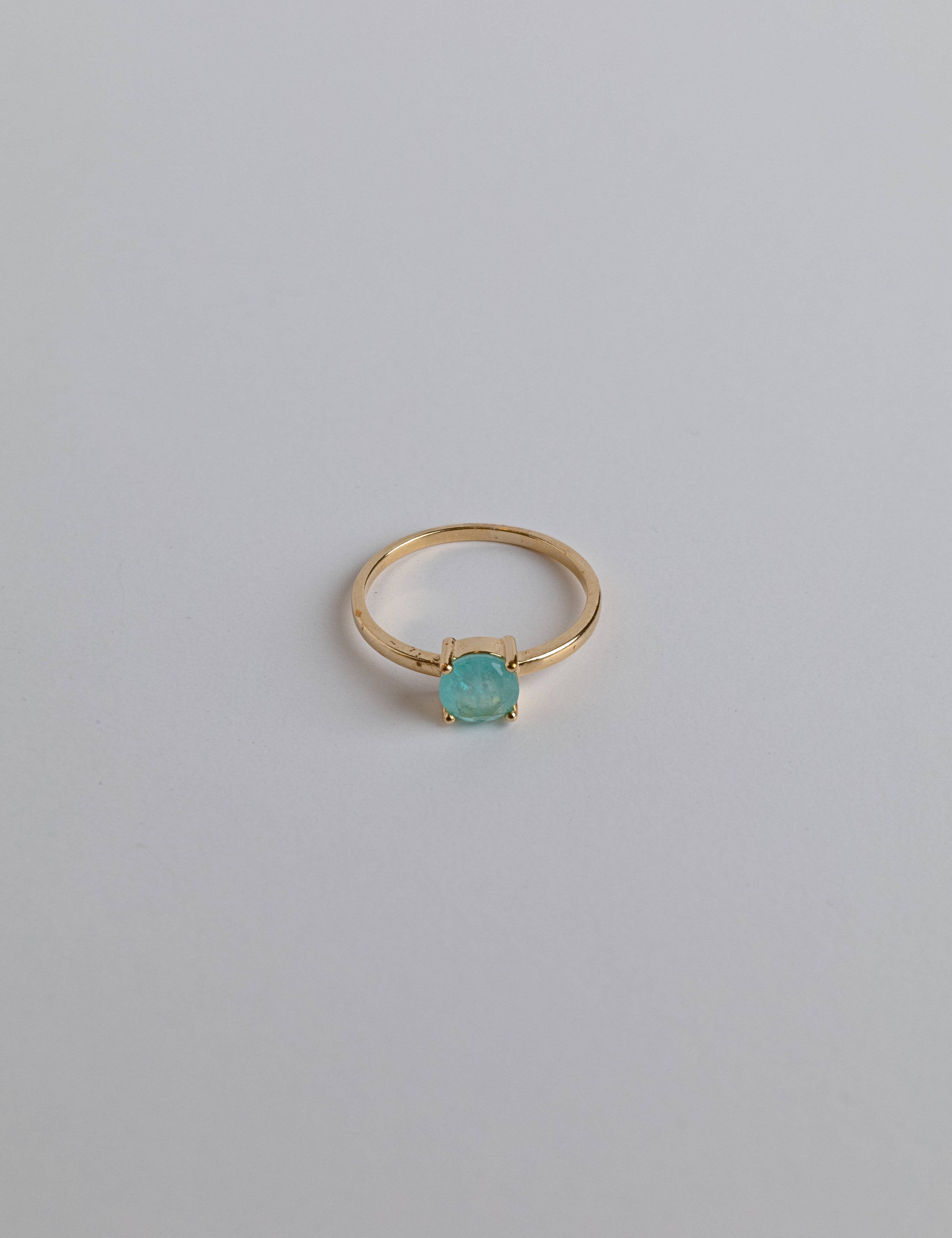14K gold stone ring with a turquoise crystal centerpiece
