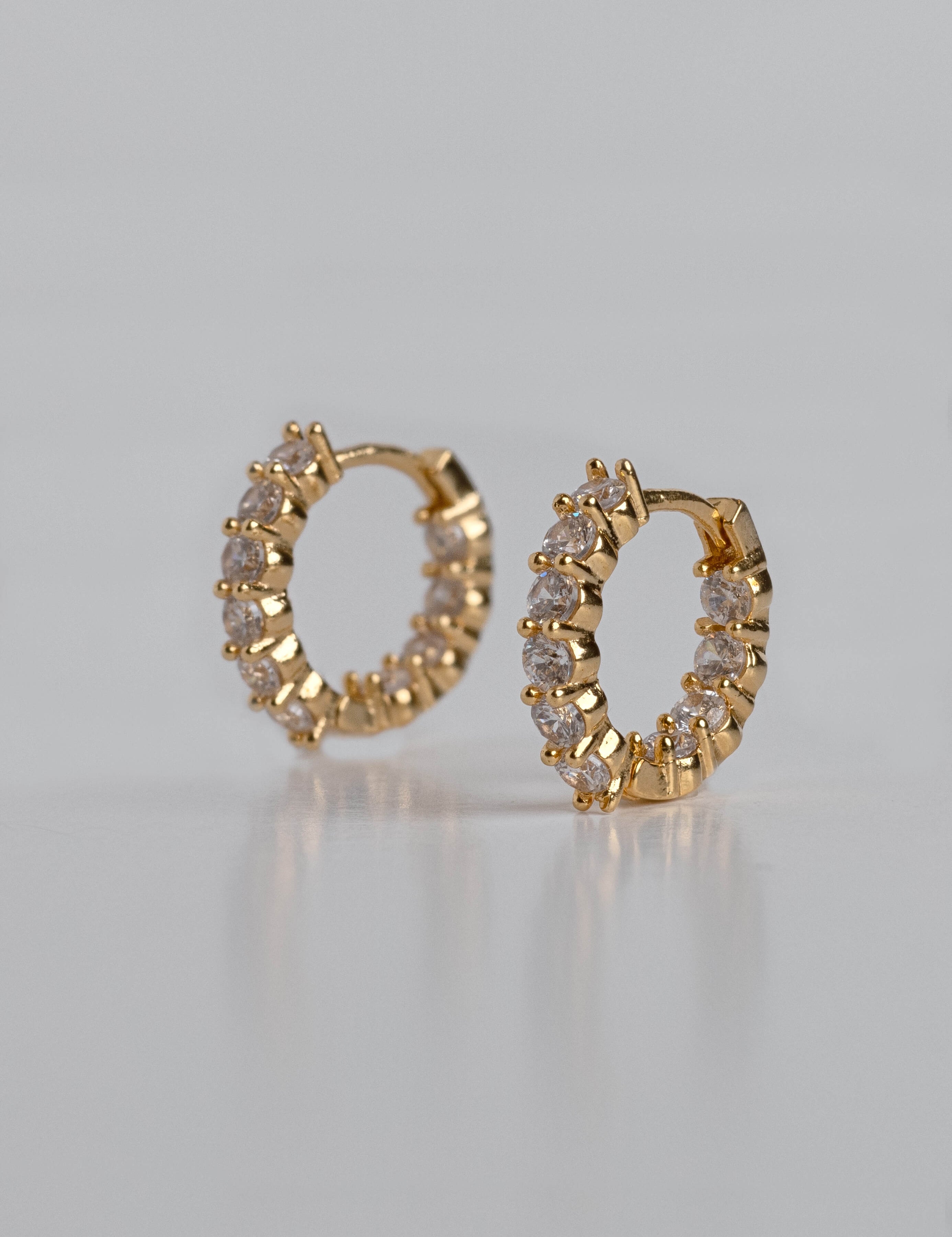 Aurora earrings with gold hoop earring set and small dangle earrings, a timeless and chic accessory.