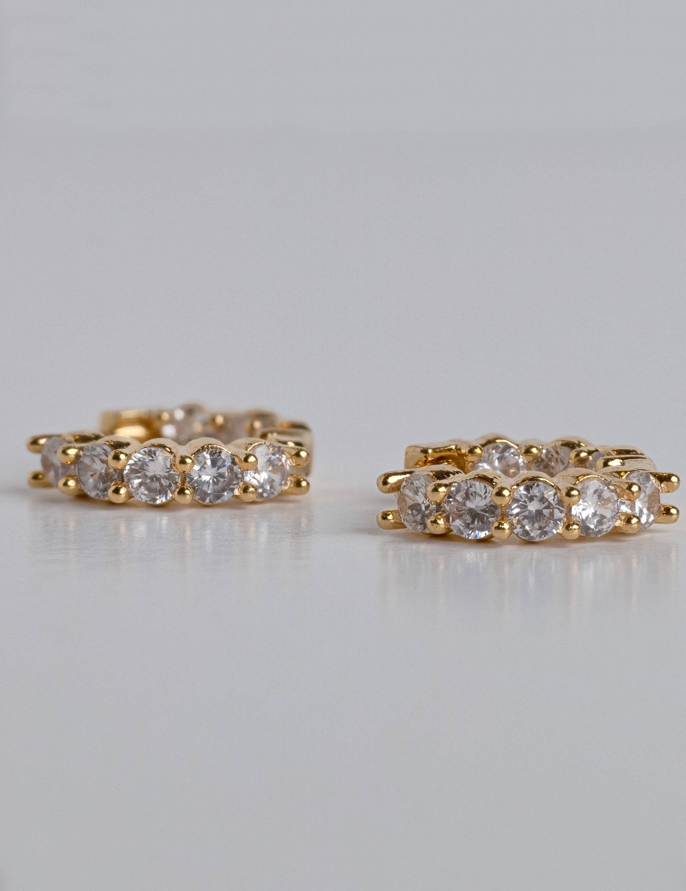 Aurora earrings with gold hoop earring set and small dangle earrings, a timeless and chic accessory.