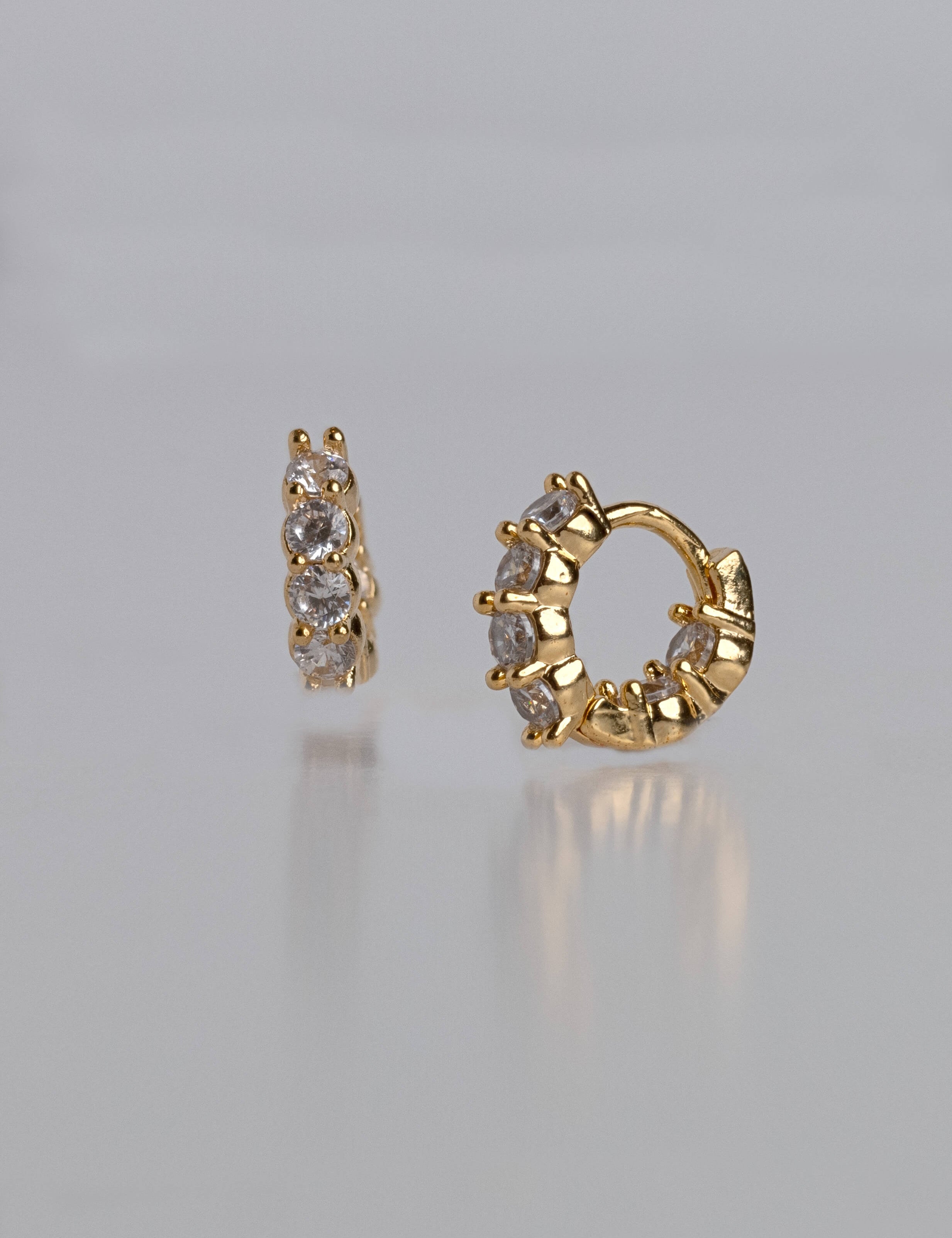Aurora earrings with gold hoop earring set and small dangle earrings, a timeless and chic accessory.