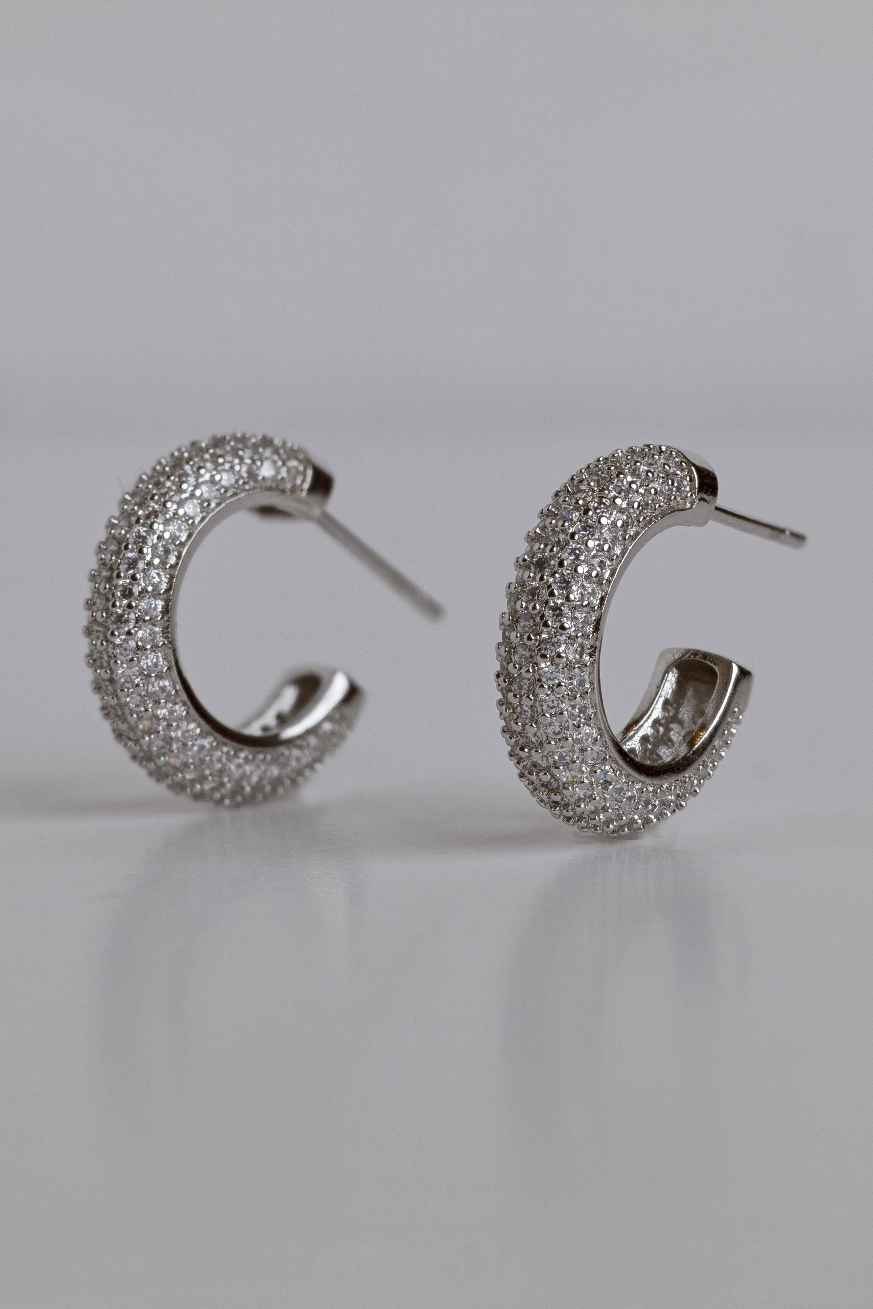 Amelia earrings with gold hoop earring set and small dangle earrings, a timeless and chic accessory.