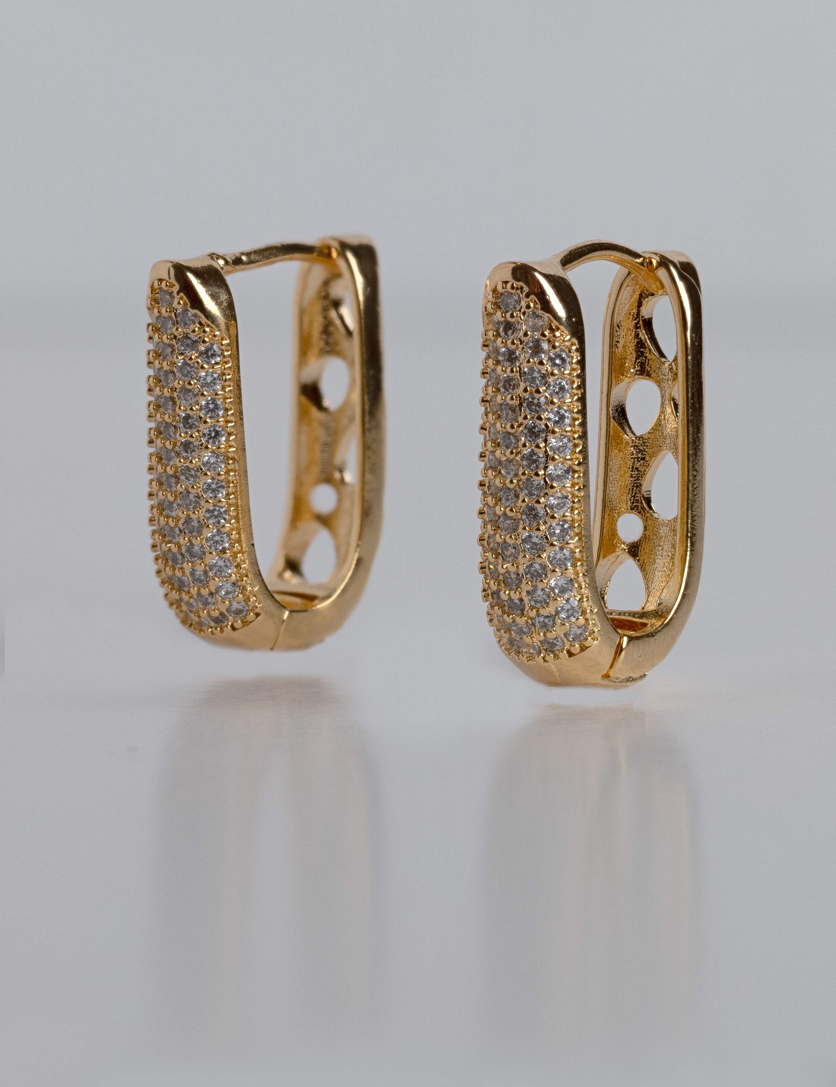 Geovanna earrings with gold hoop earring set and small dangle earrings, a timeless and chic accessory.