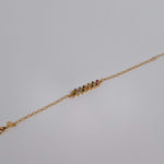 Slim gold-dipped bracelet with colored crystals, designed for a delicate and refined look.