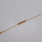 Slim gold-dipped bracelet with colored crystals, designed for a delicate and refined look.