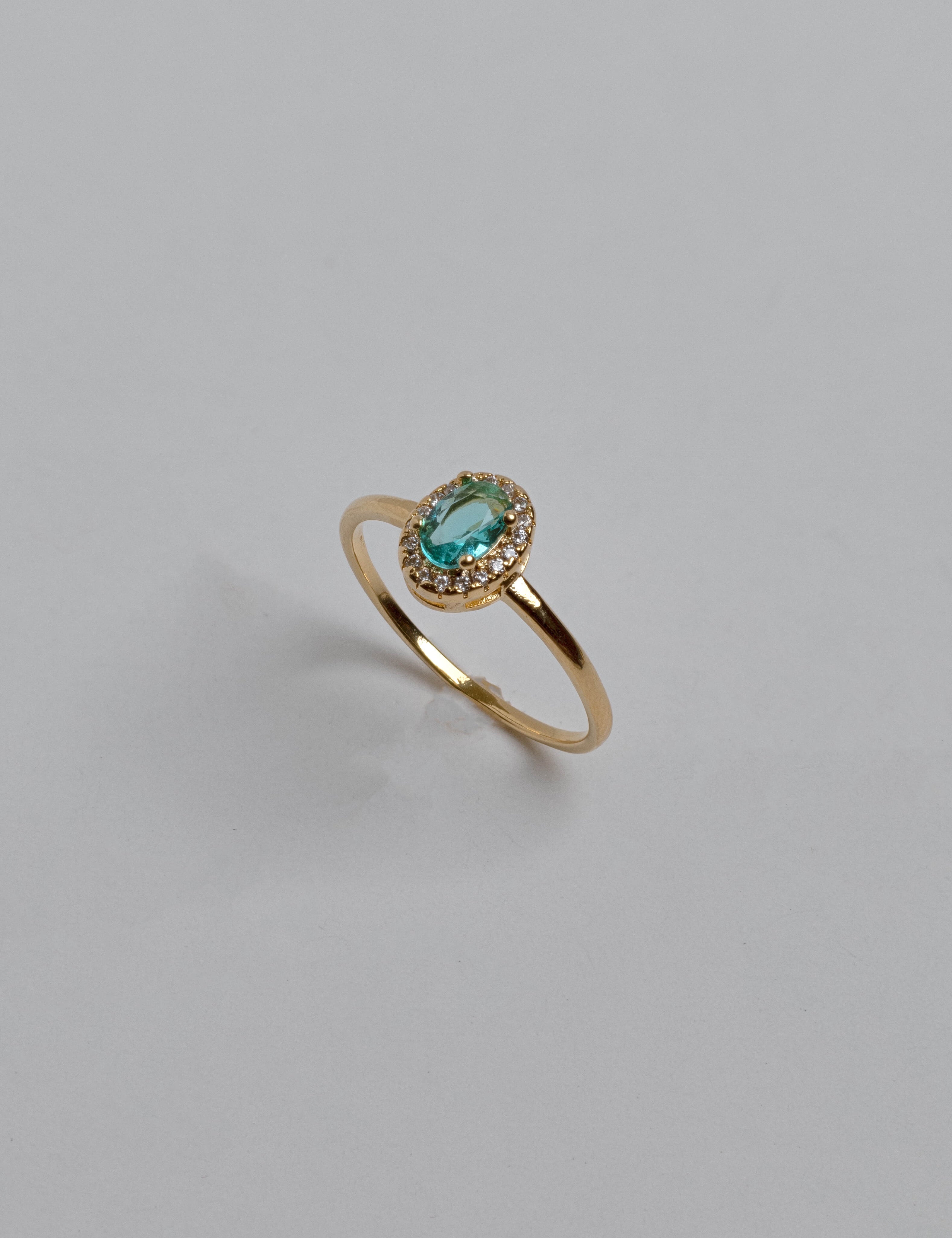 Dainty green zirconia ring with sparkling light green stones on elegant band, versatile Loon Concept jewelry