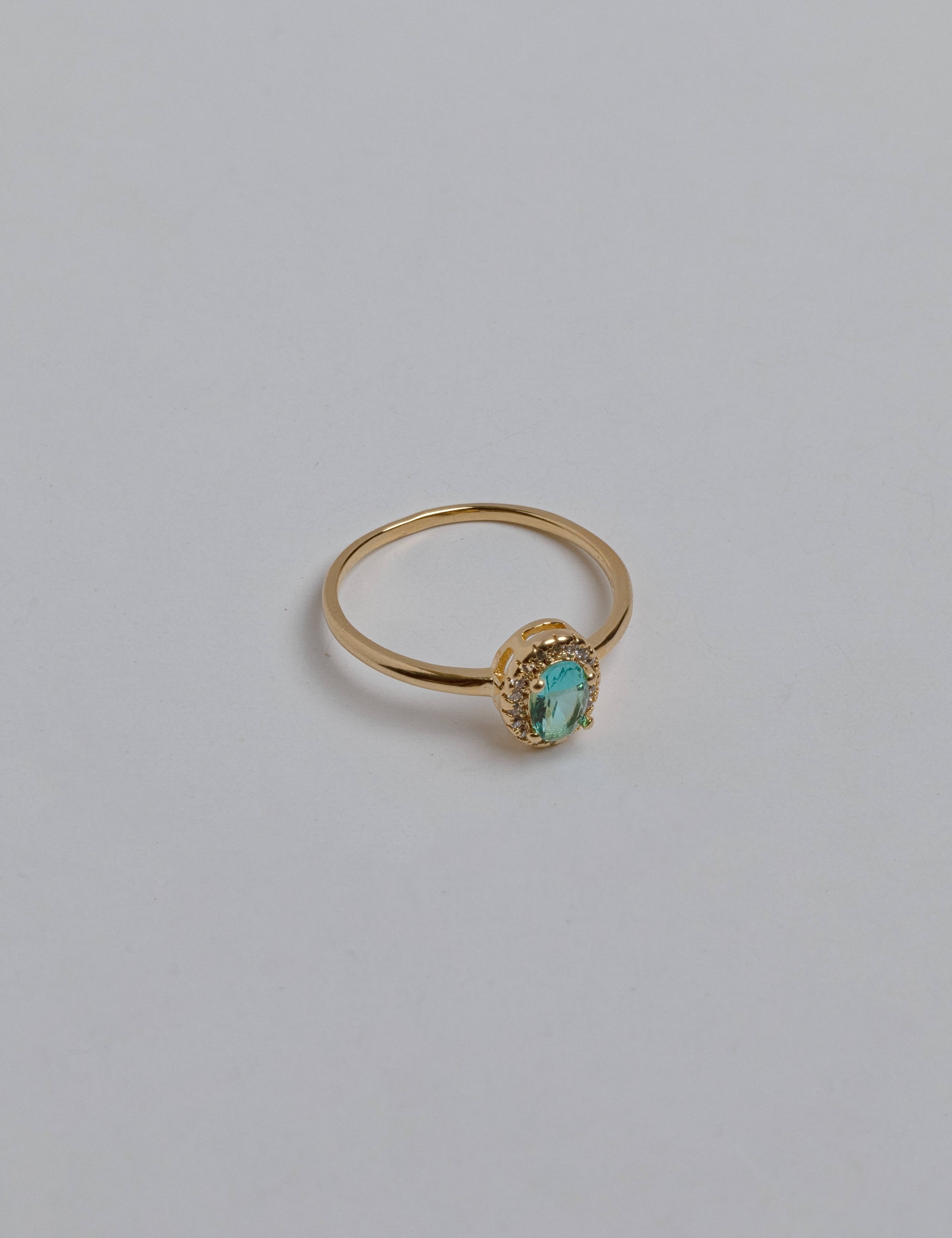 Dainty green zirconia ring with sparkling light green stones on elegant band, versatile Loon Concept jewelry