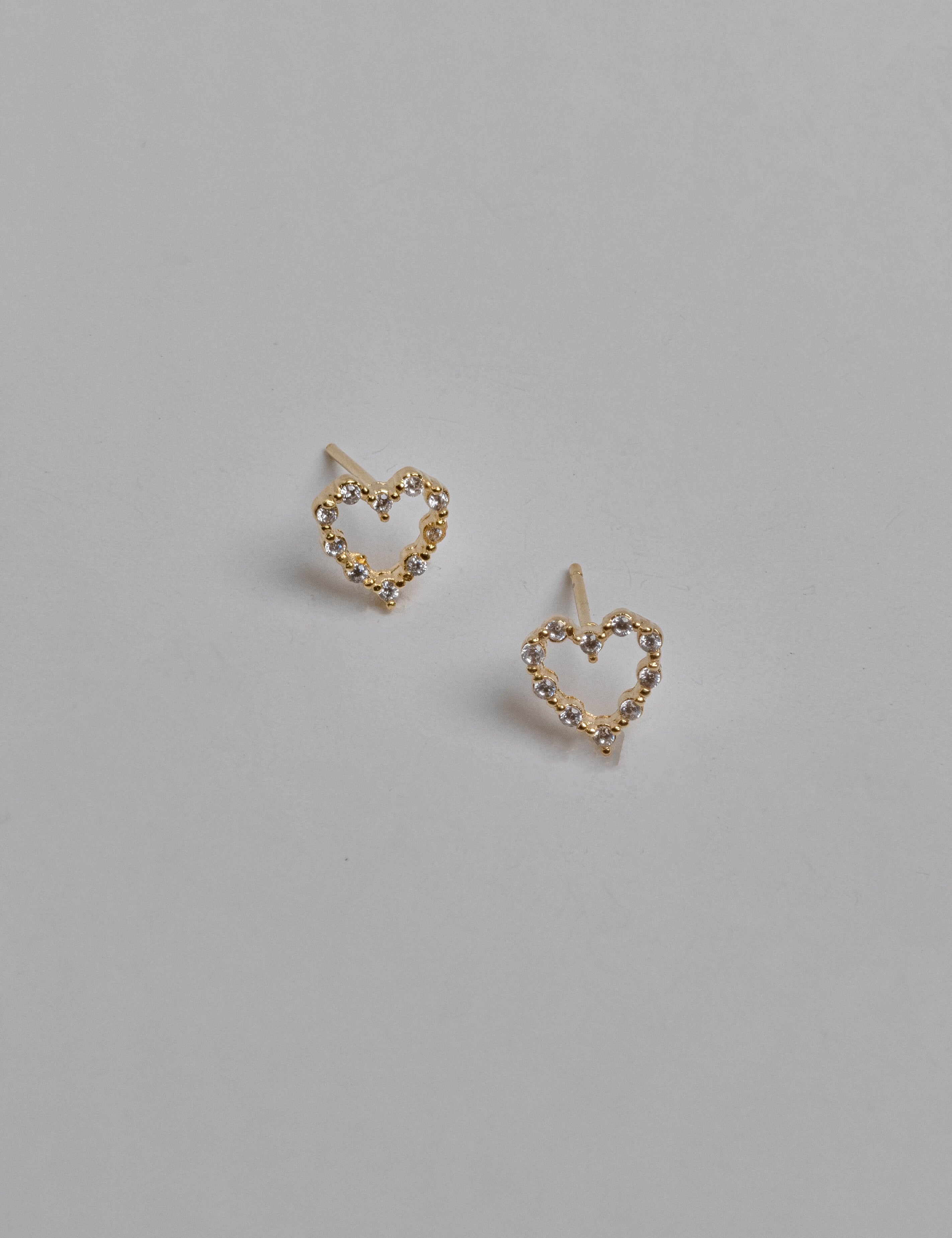 Angelica earrings with gold hoop earring set and small dangle earrings, a timeless and chic accessory.