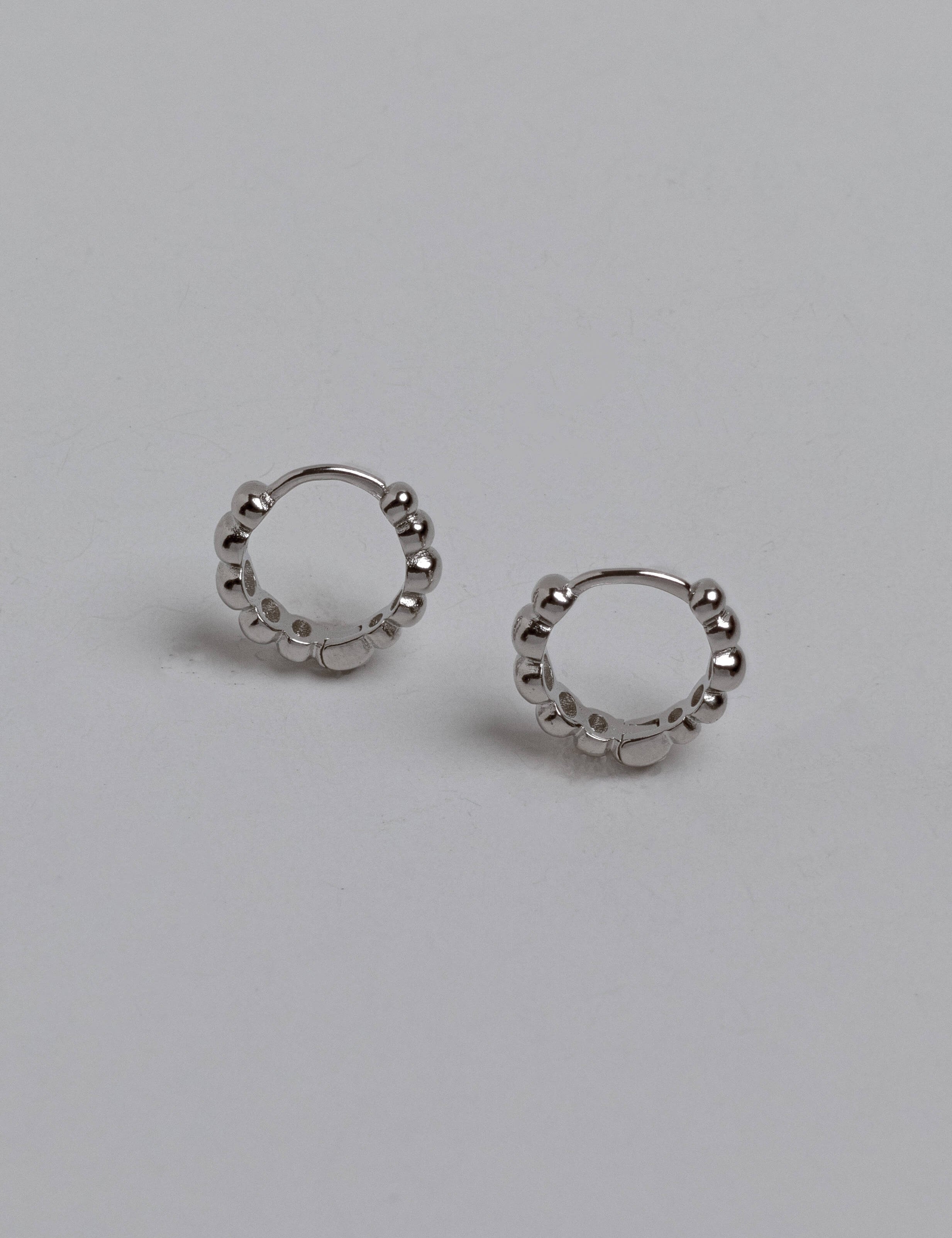Brianna earrings with gold hoop earring set and small dangle earrings, a timeless and chic accessory.