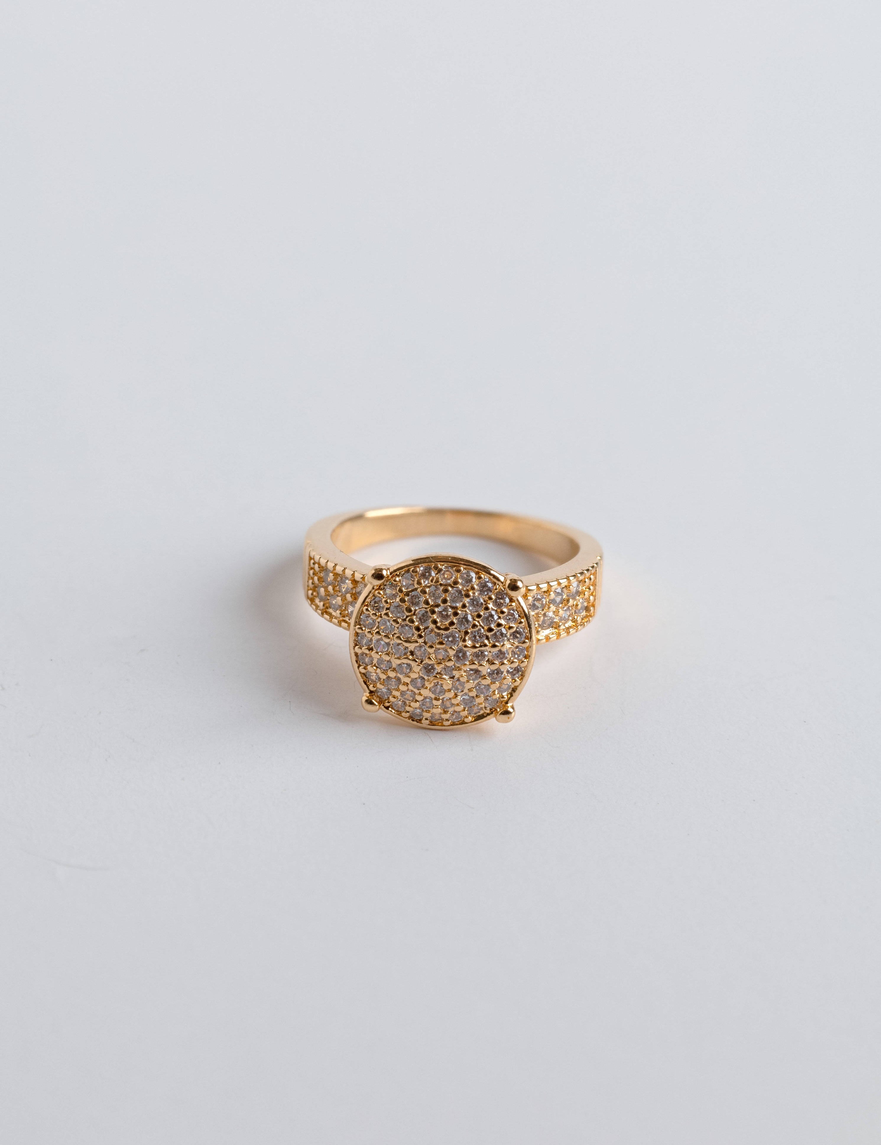 Luxurious 14K gold ring with studded zirconia design capturing light with brilliant sparkle, elegant Loon Concept jewelry