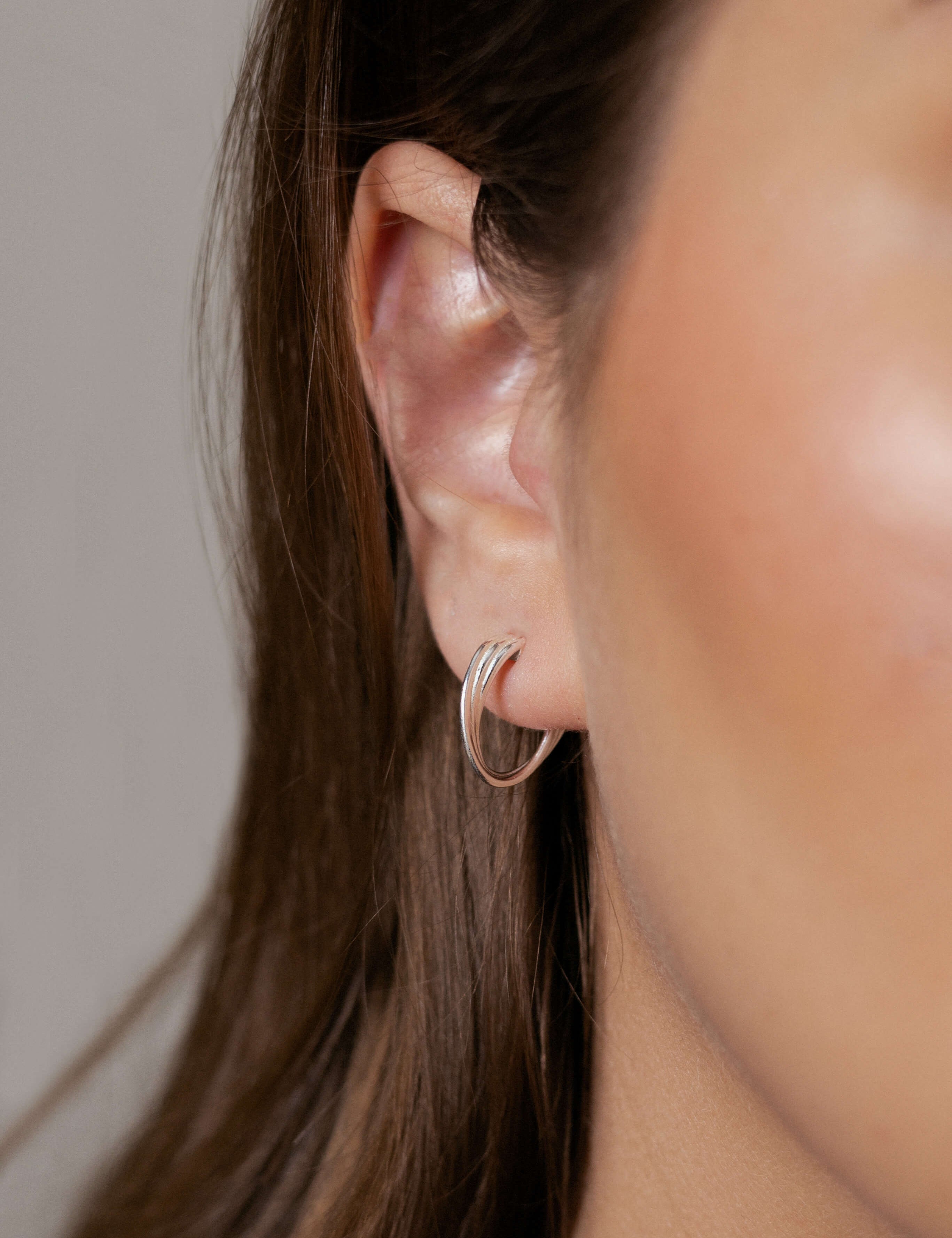 Betina earrings with gold hoop earring set and small dangle earrings, a timeless and chic accessory.
