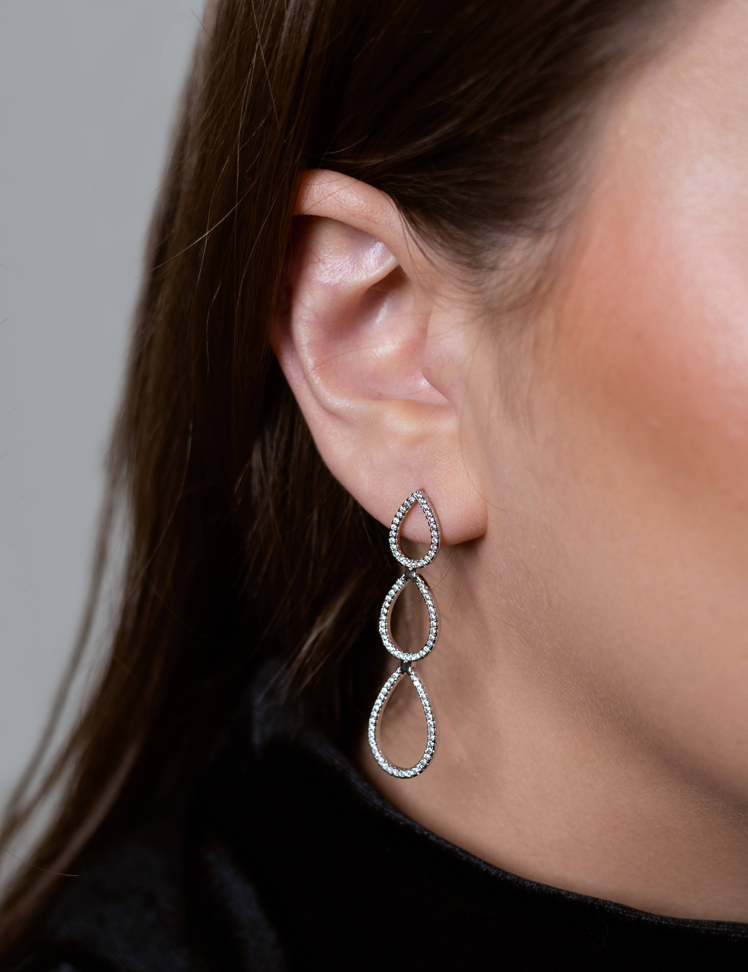 Penelope earrings with gold hoop earring set and small dangle earrings, a timeless and chic accessory.