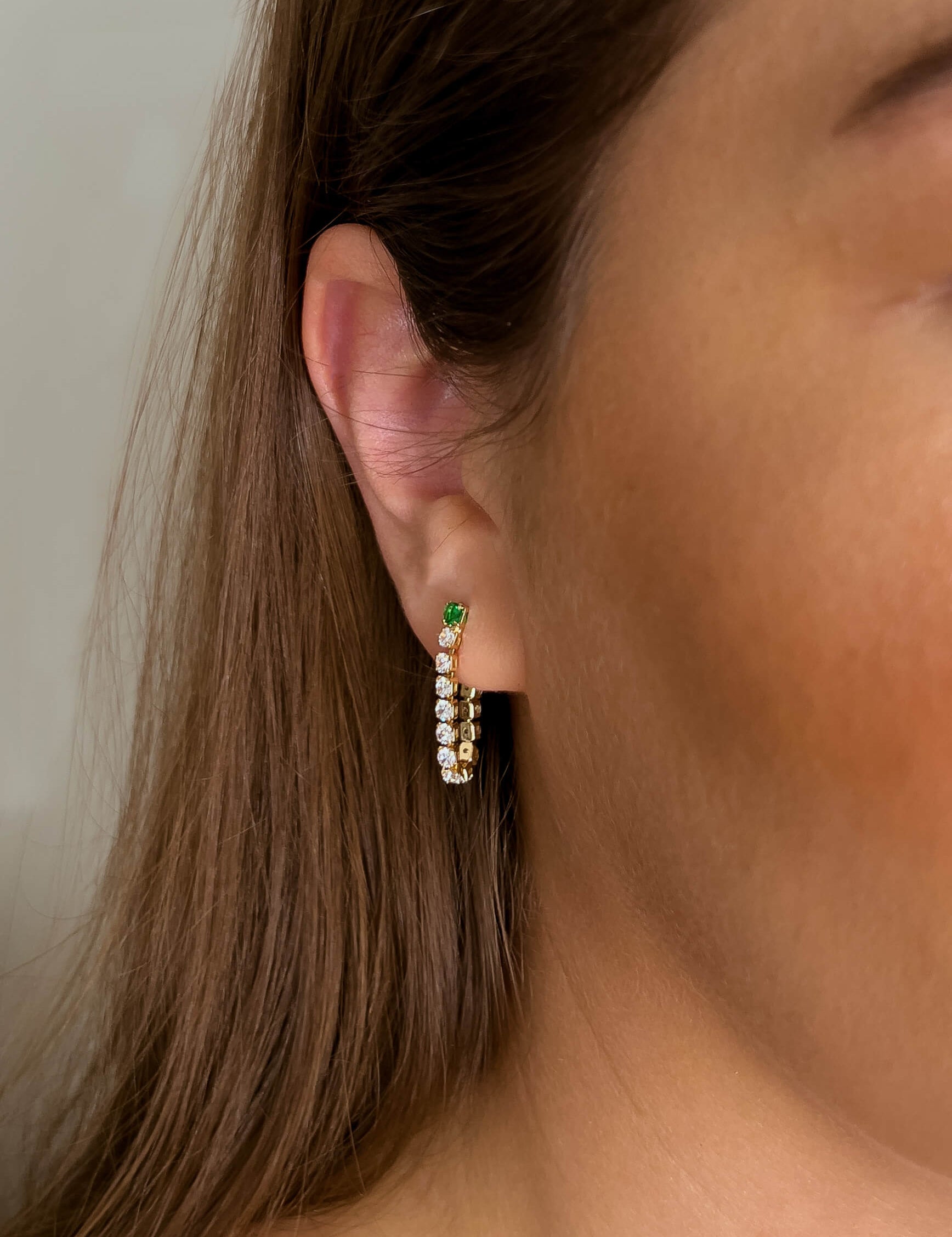 Stella earrings with gold hoop earring set and small dangle earrings, a timeless and chic accessory.
