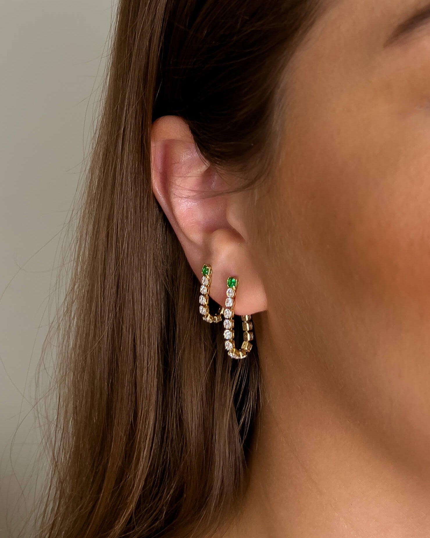 Stella earrings with gold hoop earring set and small dangle earrings, a timeless and chic accessory.