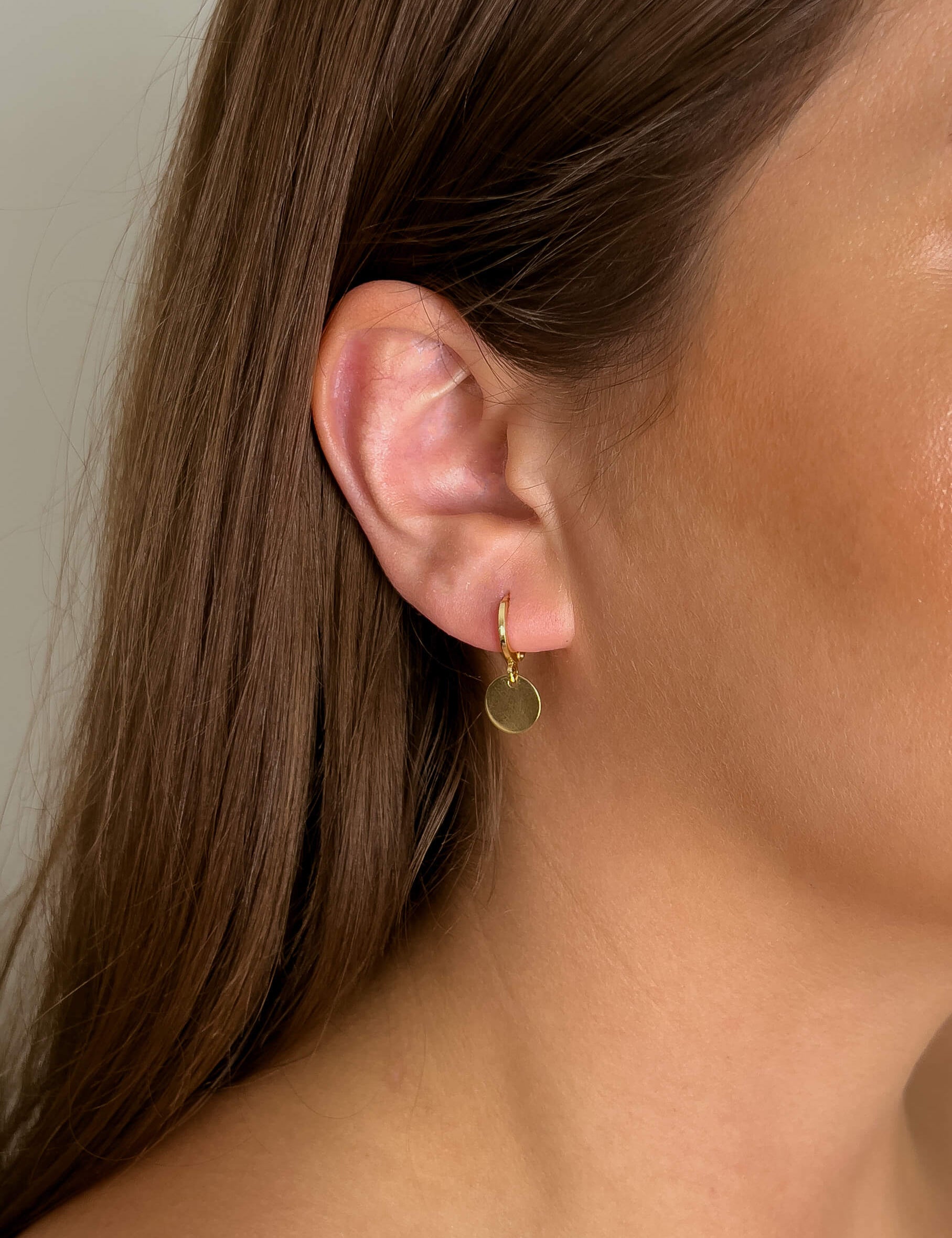 Zahra earrings with gold hoop earring set and small dangle earrings, a timeless and chic accessory.