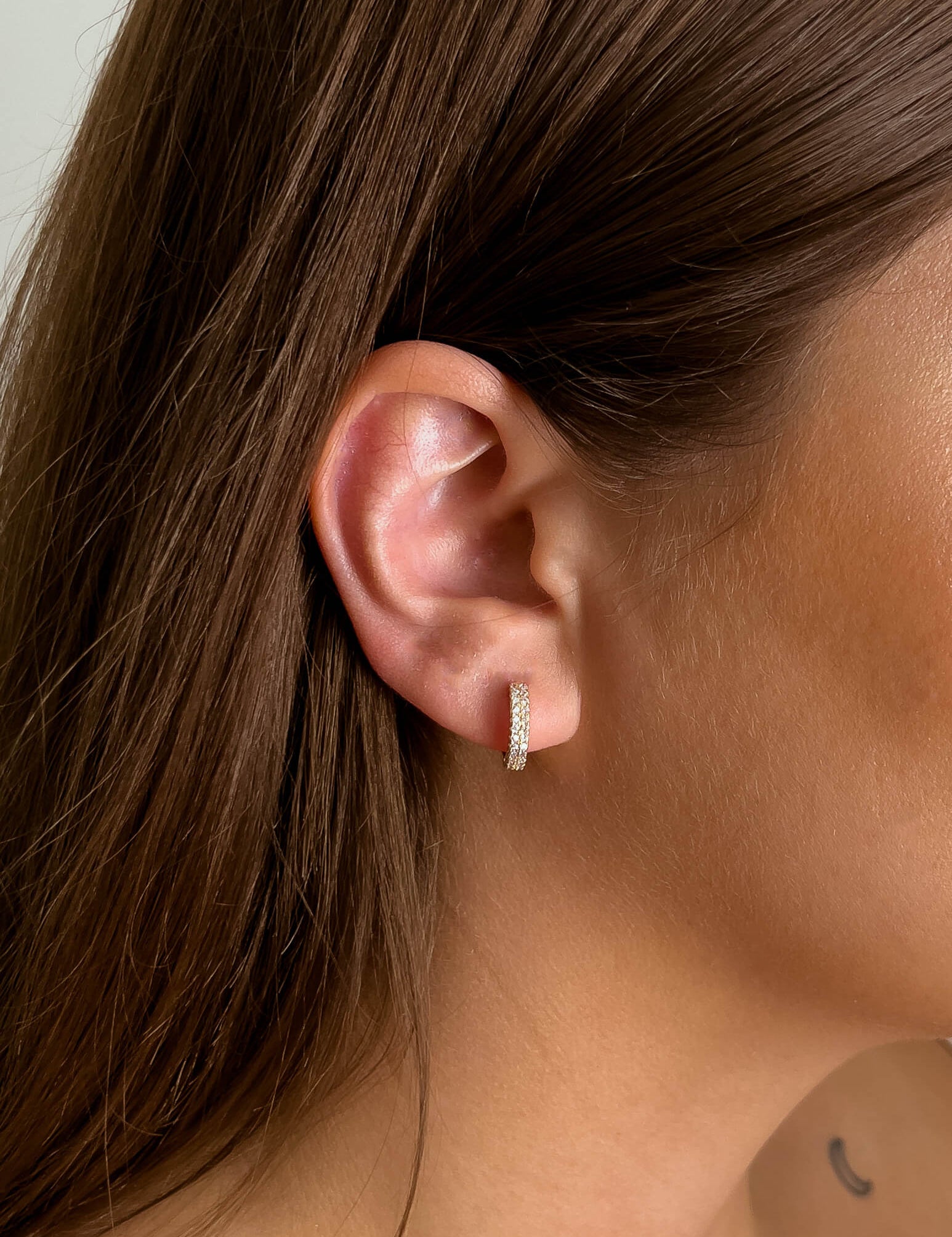 Maya earrings with gold hoop earring set and small dangle earrings, a timeless and chic accessory.