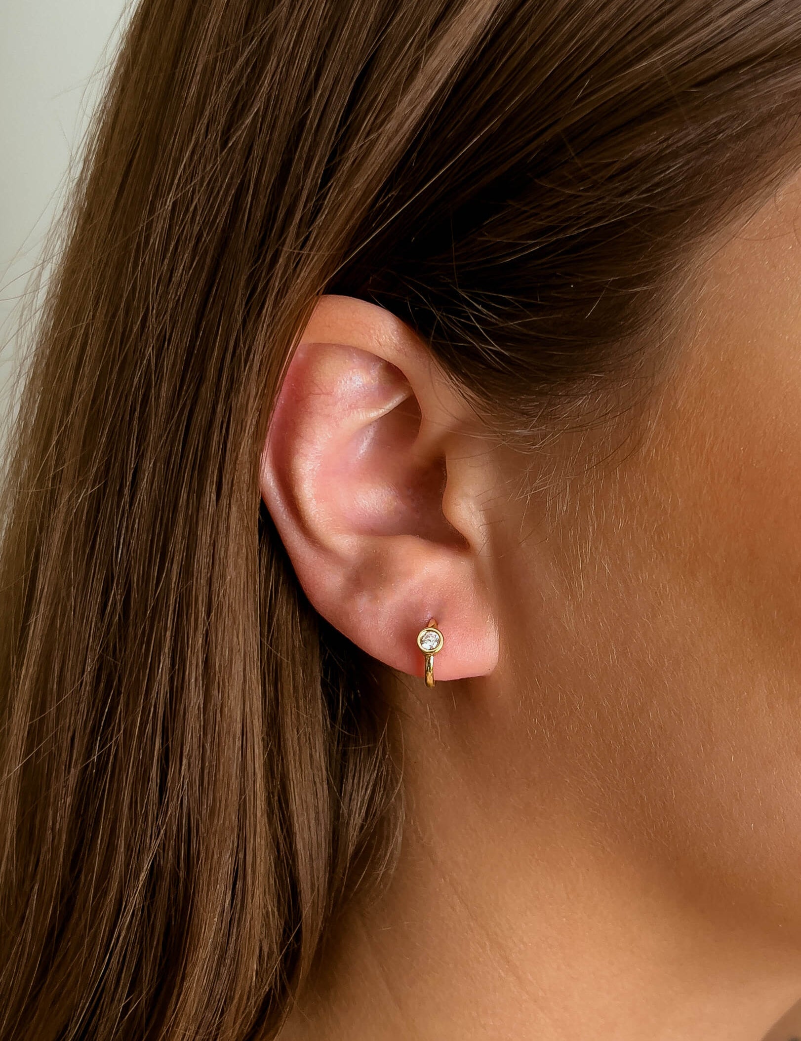 Larissa earrings with gold hoop earring set and small dangle earrings, a timeless and chic accessory.