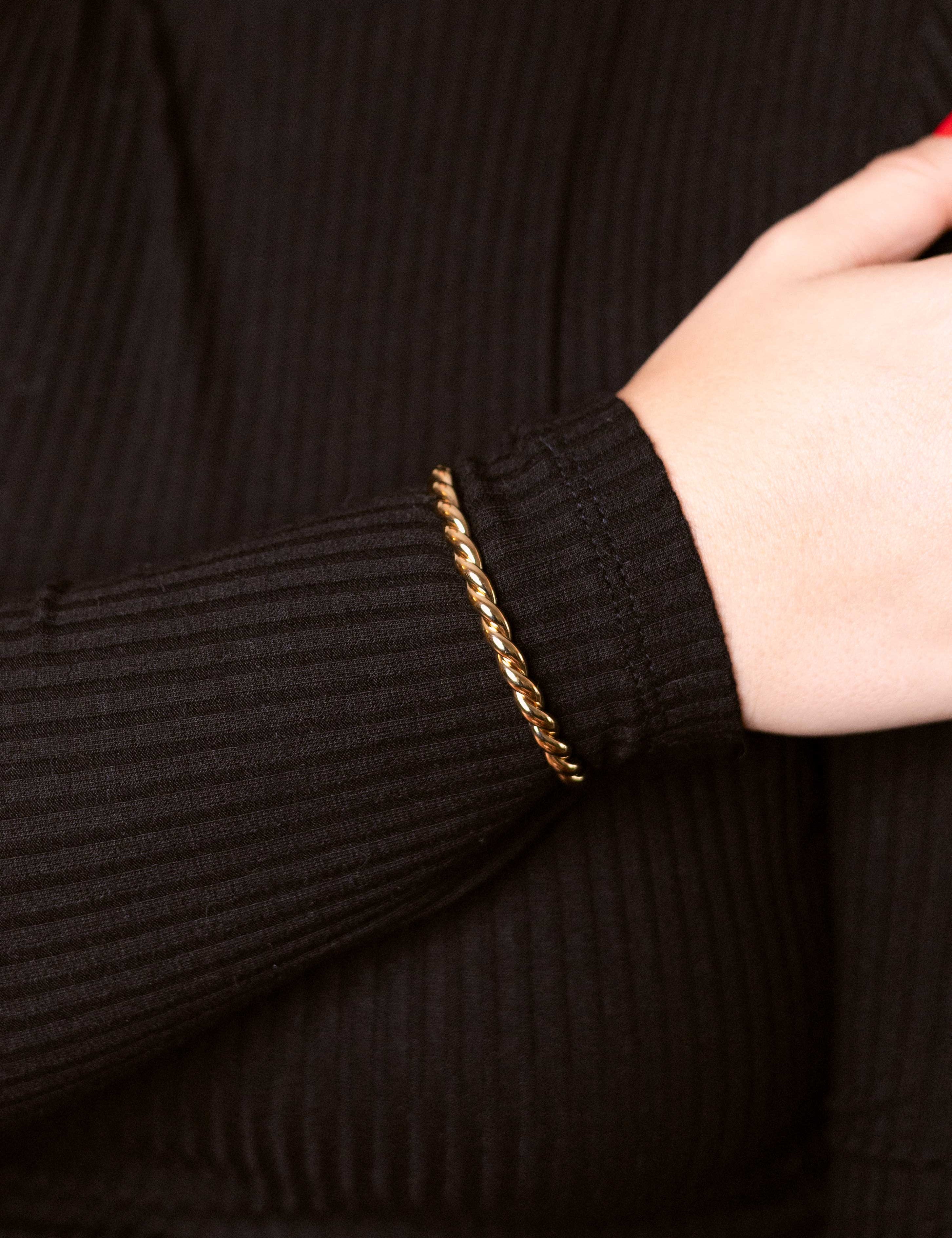 Gold-dipped twisted bracelet with a sculpted, textured design—perfect for an elegant and modern women’s gold bracelet look.