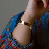 Gold-dipped evil eye bracelet with a protective design, crafted for everyday wear.